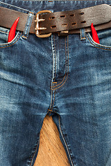 Image showing vintage jeans with red chili pepper