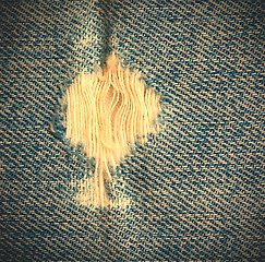 Image showing frayed blue jeans