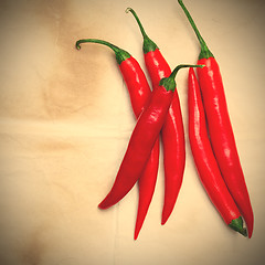 Image showing chili pepper on a wooden surface