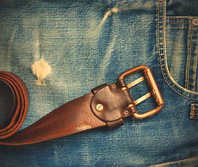 Image showing vintage leather belt on old jeans