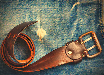 Image showing vintage belt on old blue jeans