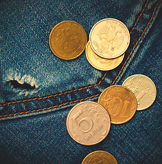 Image showing jeans pocket with hole and coins