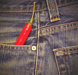 Image showing chili peppers in a jeans pocket