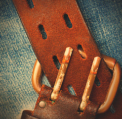 Image showing unfastened old leather belt with vintage buckles