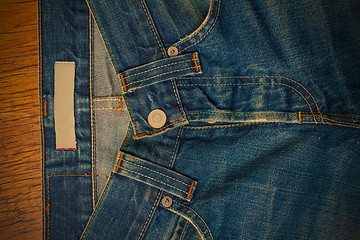 Image showing indigo jeans with a button