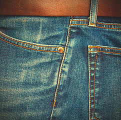 Image showing jeans with a brown leather belt