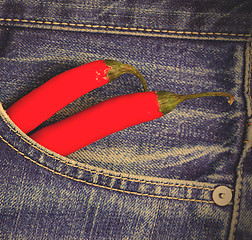 Image showing red peppers in a jeans pocket
