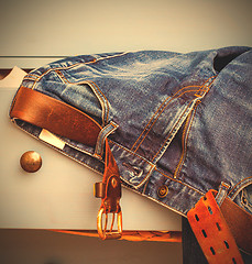 Image showing jeans sticking out of a drawer