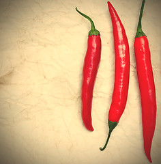 Image showing three red hot chili peppers