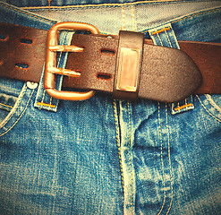 Image showing leather belt on old jeans