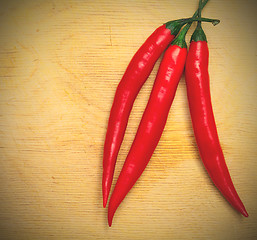 Image showing three red hot chili peppers