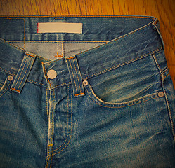 Image showing indigo jeans with a button