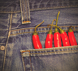 Image showing red peppers in a jeans pocket
