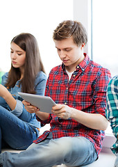 Image showing student looking into tablet pc at school