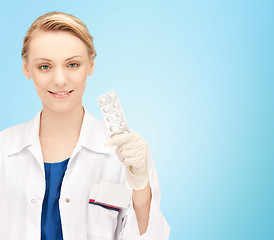 Image showing happy female doctor with pills