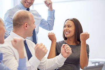 Image showing smiling business people meeting in office