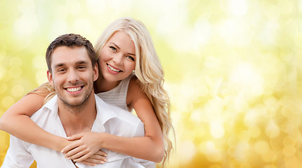 Image showing couple having fun over blue lights background