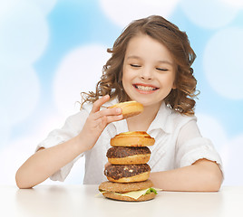 Image showing happy smiling girl with junk food