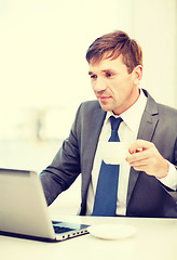 Image showing businessman working with laptop computer