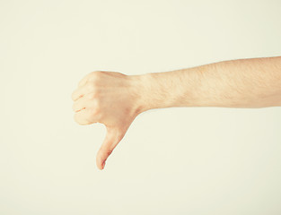 Image showing man showing thumbs down