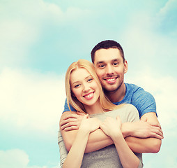 Image showing smiling couple hugging