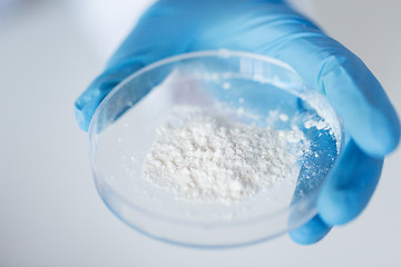 Image showing close up of scientist holding petri dish in lab