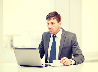 Image showing businessman working with laptop computer