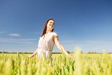 Image showing smiling young woman on cereal field
