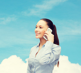 Image showing young smiling businesswoman with smartphone