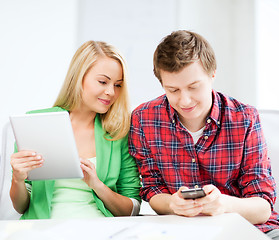 Image showing students using smartphone and tablet pc at school