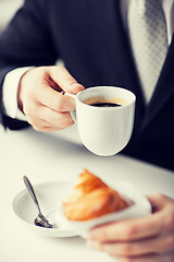 Image showing man with tablet pc and cup of coffee