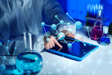 Image showing close up of scientist with tablet pc in laboratory