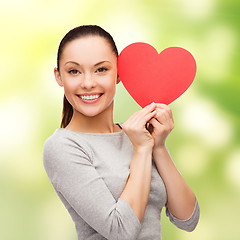 Image showing smiling asian woman with red heart