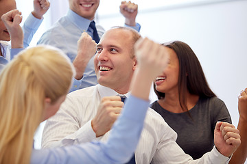 Image showing smiling business people meeting in office