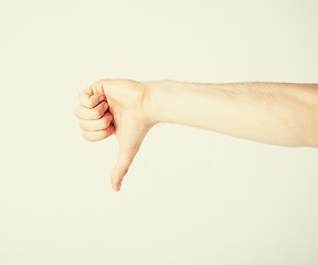 Image showing man showing thumbs down