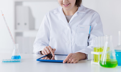 Image showing close up of scientist with tablet pc in lab