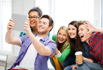 Image showing students taking selfie with tablet pc at school