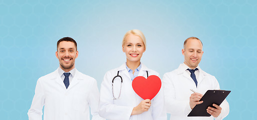 Image showing group of smiling doctors with red heart shape