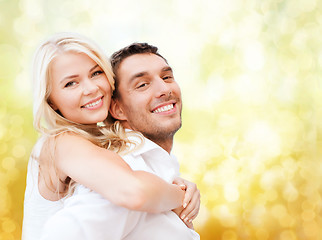 Image showing happy couple having fun over lights background