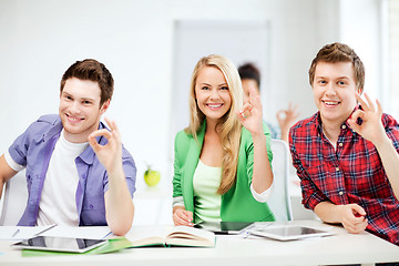 Image showing students with tablet pcs showing ok sign