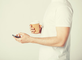 Image showing man with smartphone and coffee