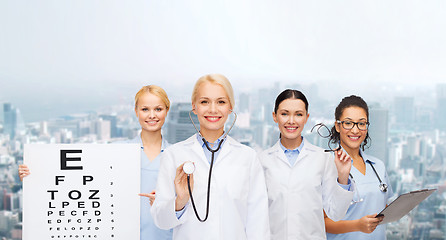 Image showing smiling female eye doctors and nurses