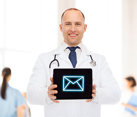 Image showing smiling male doctor with stethoscope and tablet pc