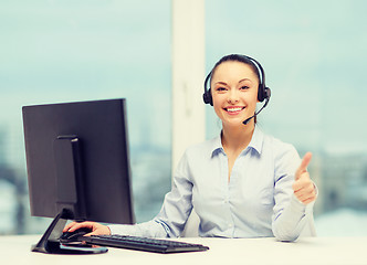 Image showing female helpline operator showing thumbs up