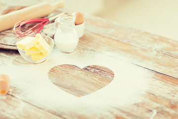 Image showing close up of heart of flour on wooden table at home