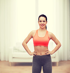 Image showing smiling teenage girl in sportswear