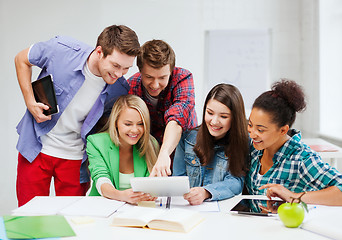 Image showing students looking at tablet pc at school