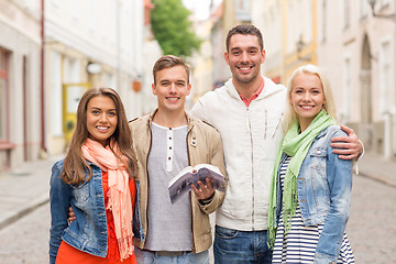 Image showing group of friends with city guide exploring town