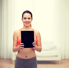 Image showing sporty woman with tablet pc blank screen