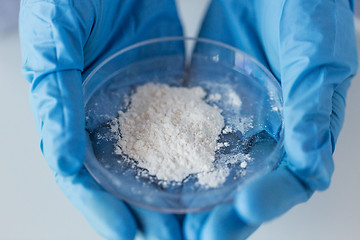 Image showing close up of scientist holding petri dish in lab